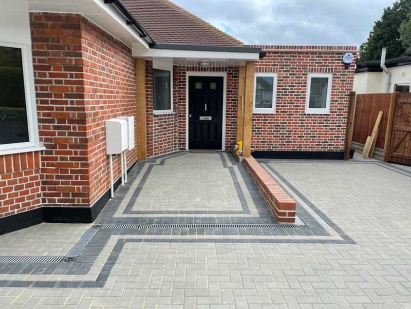 Completed Harcourt Exteriors block-paved frontage with drainage detail