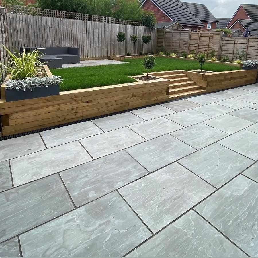 Raised garden transformation with a new lawn, timber planters and paved patio