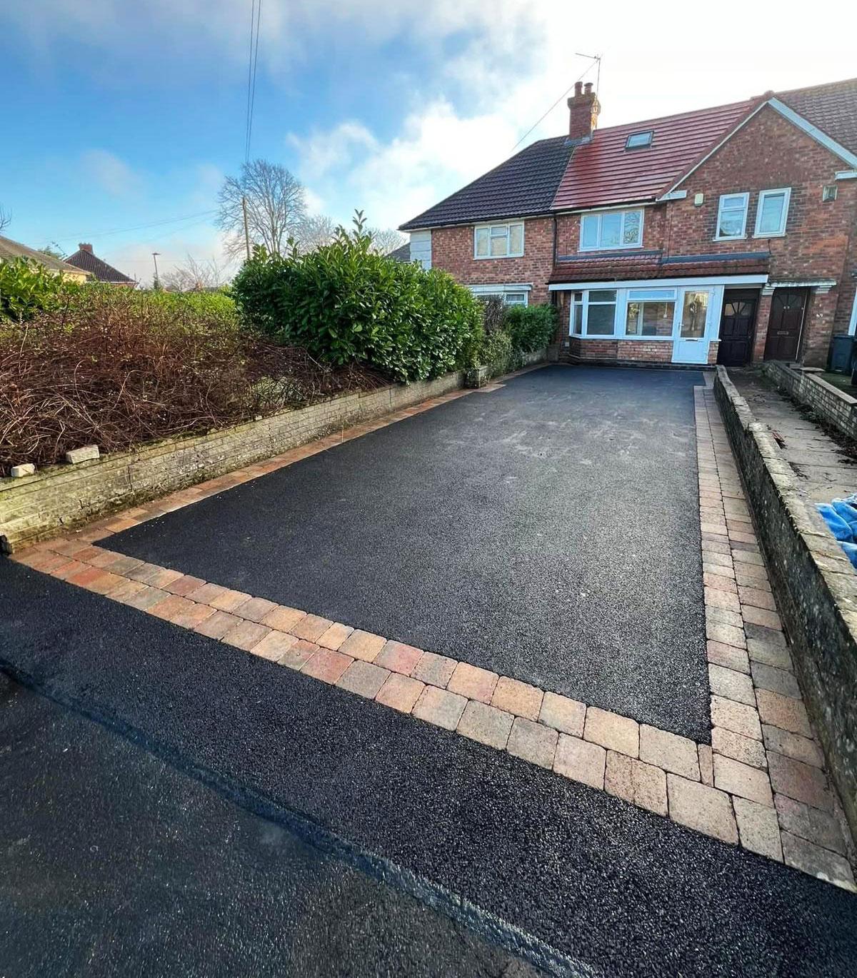 Finished tarmac front driveway with warm block paved edging